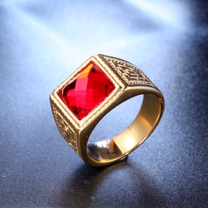 Fashionable men's gold stainless steel ring with a large rectangular red crystal gemstone