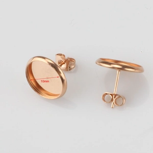 Detailed macro view of 10mm rose gold stainless steel earring tray for jewelry making
