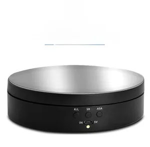 Detail view of electric display stand featuring mirror top, control buttons and USB power port