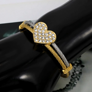 Three-row woven cable heart bangle with sparkling rhinestones in gold and silver finish