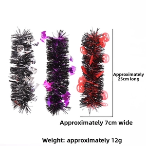 Detail of Halloween tinsel garland with skull, bat, and pumpkin motifs in 25cm length