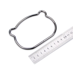 Detail view of cat ear shape dark gunmetal handle with ruler showing 11.5cm width
