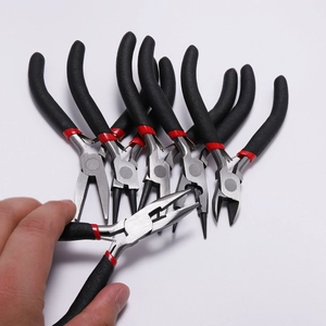 Mini DIY jewelry tool set with needle nose pliers and black non-slip rubber handles