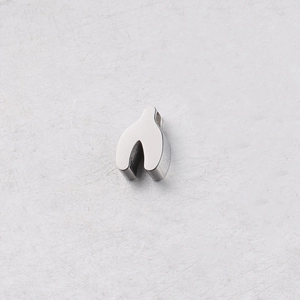 Macro shot of silver mirror-polished stainless steel wishbone bead with a small 1.8mm hole