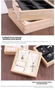 Detailed view of bamboo jewelry tray with velvet compartments for rings and necklaces