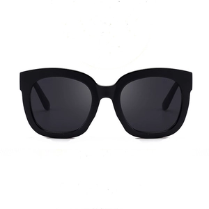 Chic oversized square black sunglasses with retro cat-eye frames and dark polarized lenses