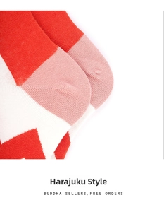 Detail of red and white geometric knit texture on stylish cotton crew socks