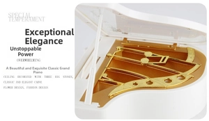 Detail showing the white piano music box with golden mechanical parts and floral engravings