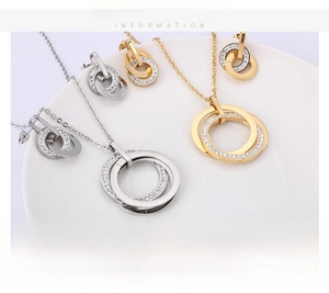 Detail of interlocking double ring jewelry set with zircon inlay in gold and silver