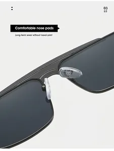 Detail view of adjustable soft silicone nose pads on matte black double bridge sunglasses