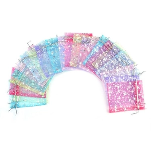 Colorful organza gift bags with gold stars and moon pattern in a fan arrangement