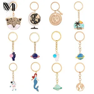 Detailed grid of twelve colorful enamel alloy keychain charms with assorted creative designs