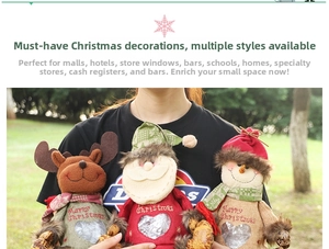 Close-up of burlap Christmas gift bags with Santa and reindeer plush figures and heart window