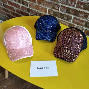 Sparkly rhinestone baseball caps in pink, blue, and bronze with a glittery finish