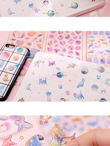 Detail showing decorative gold foil stickers on phone case and notebook for DIY scrapbooking
