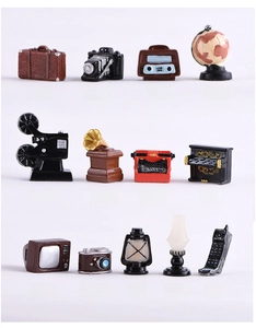 Macro view of detailed vintage resin miniatures including retro camera and gramophone