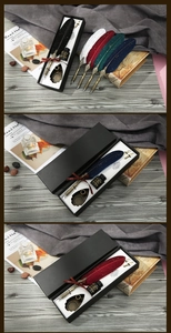 Detail shot of vintage feather pen gift set with carved metal nib and ink bottle