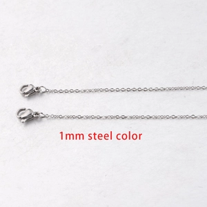 Macro shot of 1mm stainless steel square link chain with dual lobster clasps in steel color