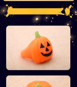 Detailed view of the orange pumpkin Halloween ring with black Jack-o'-lantern expression