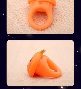Detail view of orange plastic Halloween pumpkin ring for festive party favors