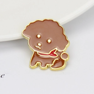 Detailed macro view of a cartoon poodle enamel pin with brown finish and red scarf