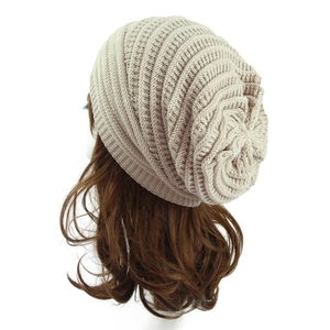 Detailed knit texture and layered fold design of this beige winter slouchy beanie