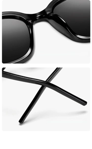 Detail of comfortable integrated nose pads and ergonomic curved temple tips of black sunglasses