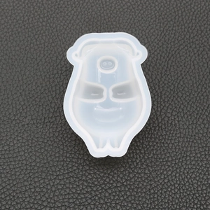 Macro shot of pig shaped clear silicone mold for DIY resin crafts on black leather
