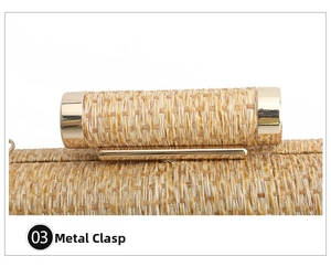 Close-up of polished gold metal clasp on handcrafted straw woven evening clutch bag