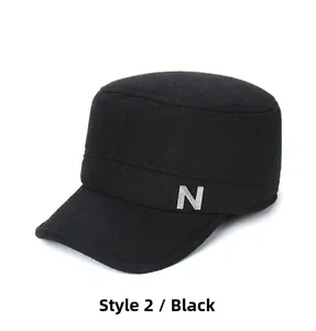 Detail of black wool military cap featuring a silver metal N letter side ornament