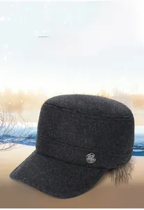 Detail of wool flat top military cap with star badge and two-way ear protection style
