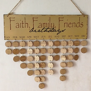 Macro shot of wooden birthday calendar board with Faith Family Friends hanging tags