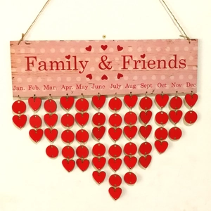 Detailed macro view of wooden Family and Friends calendar board with heart tags