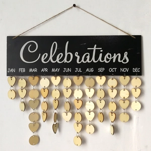 Detail of wooden birthday calendar board with heart and circle tags for home decor
