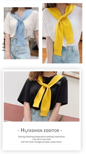 Detail of blue and yellow knitted shoulder wraps showing texture and layered styling look