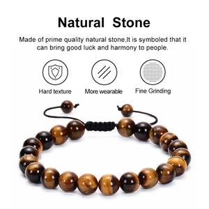 Detailed close-up of natural red tiger eye stone beads and black braided adjustable cord