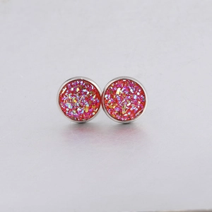 Macro shot of 10mm round red and gold glitter drusy stud earrings in stainless steel