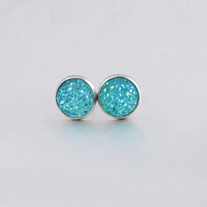 Macro detail of 10mm round blue druzy stud earrings with sparkling texture