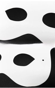 Detailed macro view of white DIY paper pulp mask showing smooth edges and strap holes