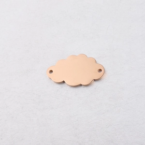Macro shot of rose gold cloud pendant with mirror finish and dual attachment holes
