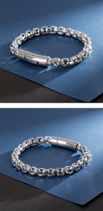 Detailed close-up of a silver stainless steel square link chain bracelet with cylinder clasp