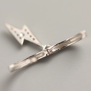 Sterling silver hoop earrings featuring lightning bolt charms with crystal diamond accents