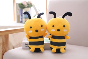 Detailed close-up of plush bumblebee toys with yellow stripes and cute antenna features
