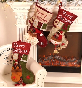 Detailed view of three festive Christmas stockings with Santa, Snowman and Reindeer 3D figures