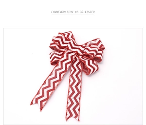 Detail of red and white chevron burlap bow with long tails for Christmas tree decoration