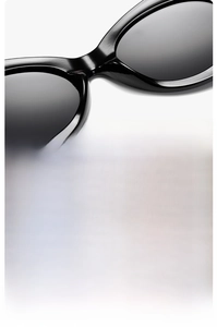 Detail view of comfortable nose pads and ergonomic curved temples of these chic oval sunglasses