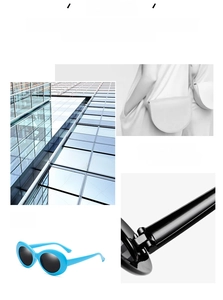 Detail view of sky blue oval polarized sunglasses featuring sturdy metal hinges and dark lenses