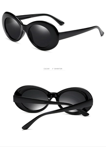 Detail view of black vintage oval sunglasses with thick frames for punk fashion