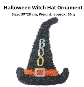 Detailed view of black witch hat door decoration with BOO text and orange sequin buckle