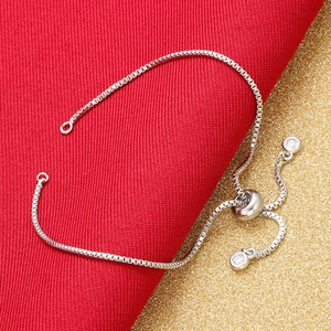 Adjustable silver box chain bracelet with sliding clasp and clear cubic zirconia charms